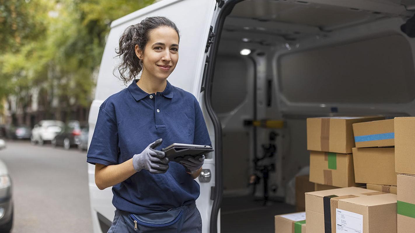 Delivery truck driver using SCM software on a tablet 