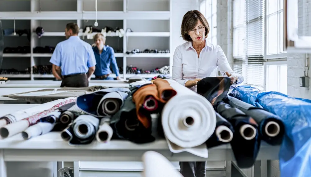 Designer assessing fabric to make product decisions