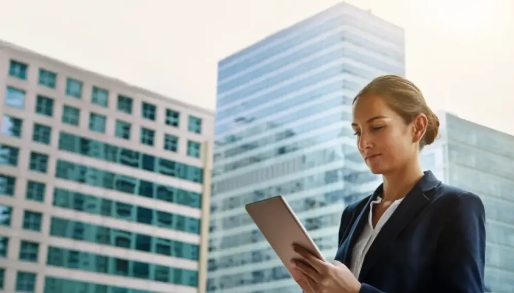 Businesswoman using cloud ERP on a tablet