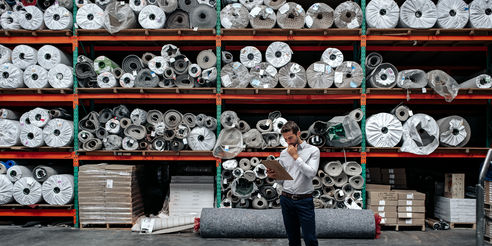 Fabric supplier managing doing inventory. supplier