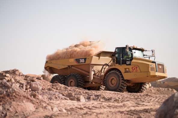 photo of a tractor working on a dirt job site