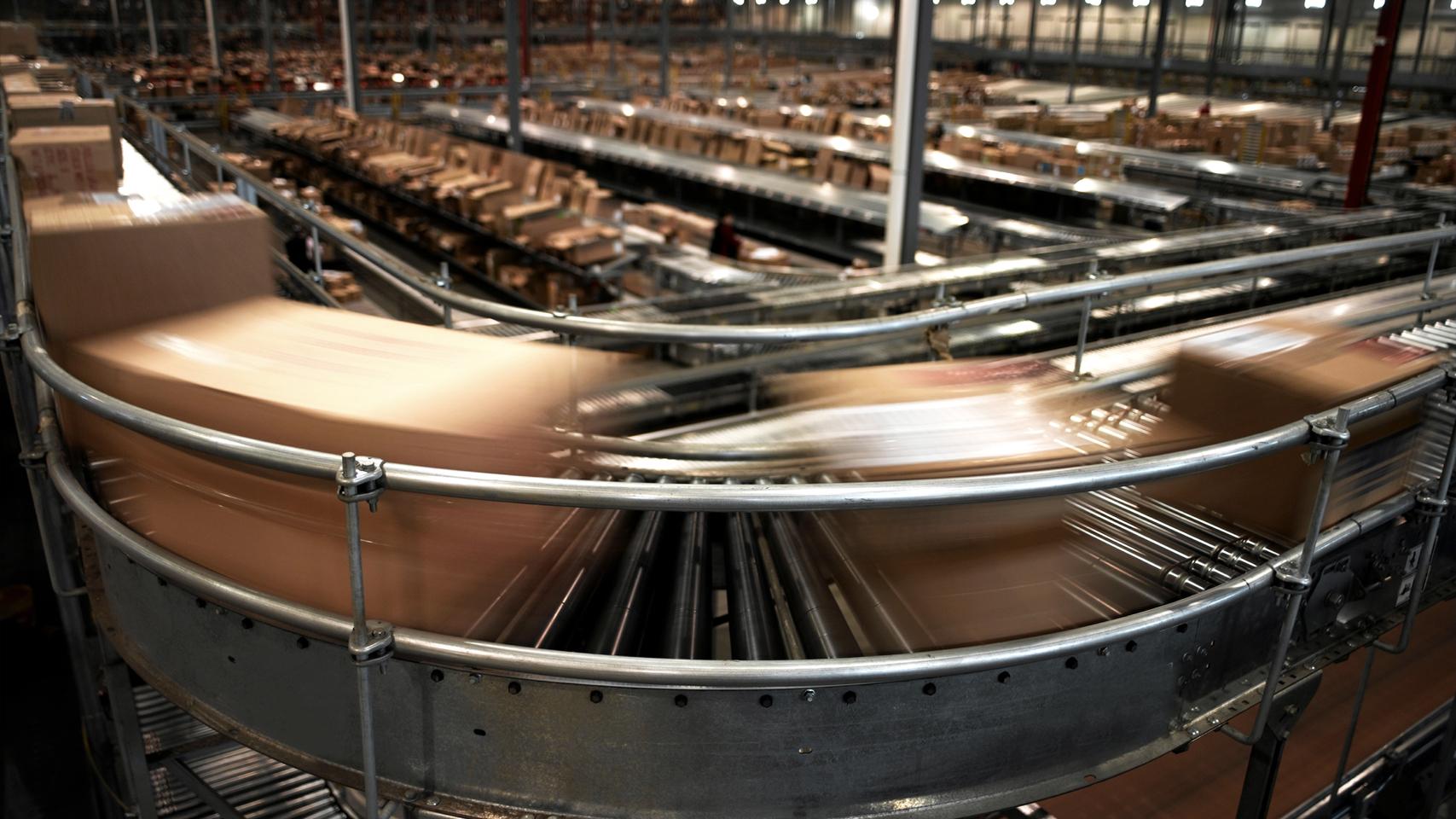 Boxes speeding by on a conveyor belt