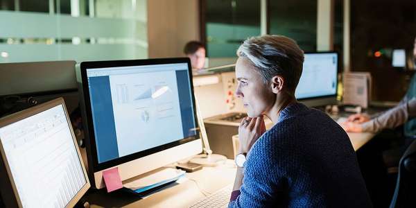 woman looking at graphs