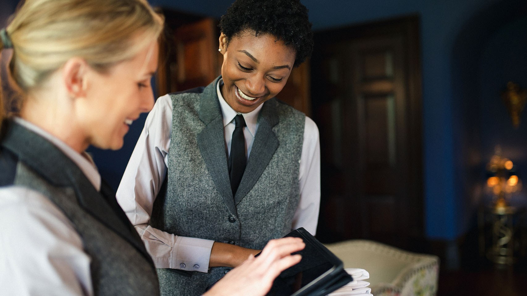 hotel staff working on a tablet