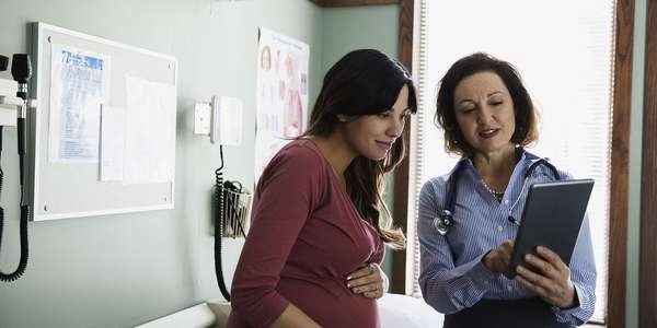 Doctor pregnant woman digital tablet   hospital healthcare  