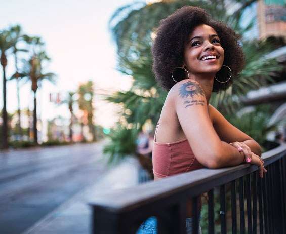 USA, Nevada, Las Vegas, portrait of happy young woman in the city, in hotel district.