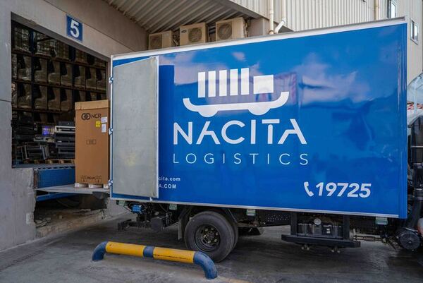 Nacita delivery truck being loaded at warehouse