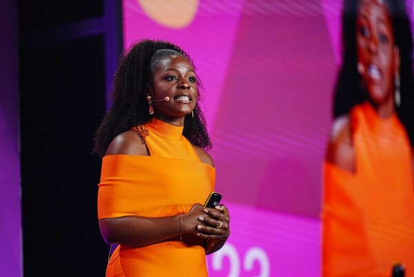 woman presenting on stage 