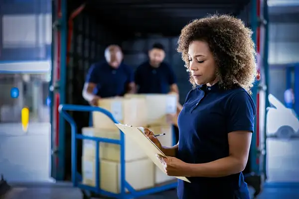 Warehouse supervisor accepting a delivery