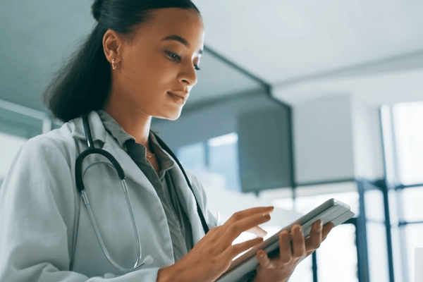 Female doctor viewing health analytics and data for her patients