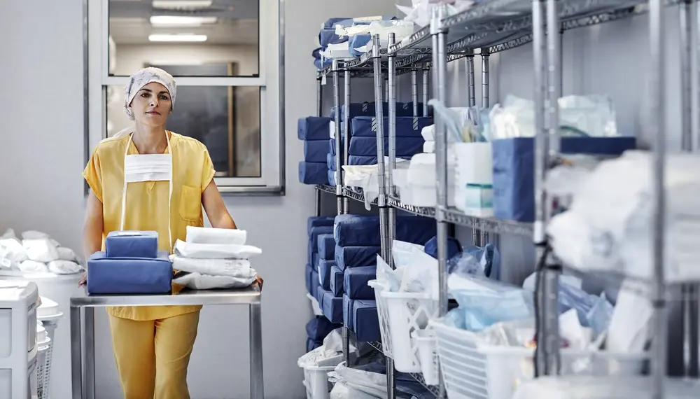 Doctor with medical supplies in a storage room