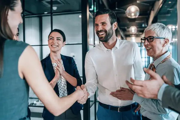 Businesspeople shaking hands in an office 