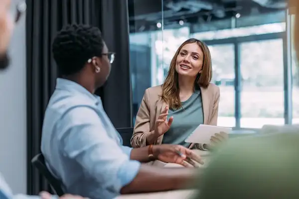 Businesswoman leading a change readiness discussion in a meeting room